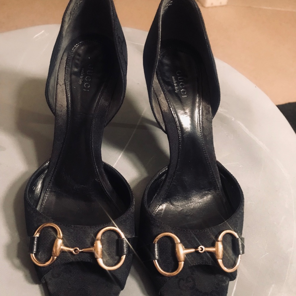 Gucci black open toe with gold hardware high thin heel shoes.